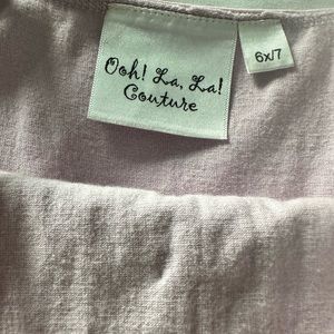 Gorgeous lavender girls party dress by luxury kids brand Oh! La, La! Couture.